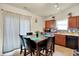 Cozy eat-in kitchen with wood cabinets, stainless steel appliances, and stylish backsplash at 6383 Enclave Blvd, Greenwood, IN 46143