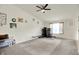 Living room featuring a ceiling fan and natural light, offering versatile living space at 6383 Enclave Blvd, Greenwood, IN 46143