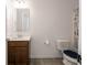 Bathroom featuring a modern vanity, toilet, and neutral color scheme at 7241 Glen Park Ln, Indianapolis, IN 46259