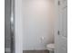A view of toilet in the bathroom near the glass shower at 7241 Glen Park Ln, Indianapolis, IN 46259