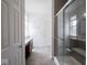 Bathroom with glass-enclosed shower and a vanity with sink on opposite sides at 7241 Glen Park Ln, Indianapolis, IN 46259