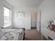 Bedroom with a bed, vanity, and carpet, with a view to the hallway at 7241 Glen Park Ln, Indianapolis, IN 46259