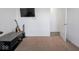 Bedroom with carpet, TV, guitars, and neutral wall color at 7241 Glen Park Ln, Indianapolis, IN 46259