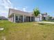 Charming brick home featuring a covered front porch, a two-car garage, and green lawn at 7241 Glen Park Ln, Indianapolis, IN 46259