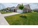 Brick home featuring a two-car garage, well-maintained lawn, and inviting curb appeal at 7241 Glen Park Ln, Indianapolis, IN 46259