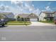 Inviting one-story home featuring a brick facade, attached two-car garage, and well-manicured front lawn at 7241 Glen Park Ln, Indianapolis, IN 46259