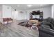 Bright living room featuring a comfortable seating area and modern entertainment center at 7241 Glen Park Ln, Indianapolis, IN 46259