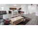Open living area showcasing the modern kitchen, stylish furniture, and beautiful flooring at 7241 Glen Park Ln, Indianapolis, IN 46259