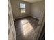 Sunlit bedroom showing the window and new laminate flooring at 7313 Shanna Cir, Indianapolis, IN 46236