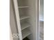 A walk-in closet with shelving provides ample storage at 7313 Shanna Cir, Indianapolis, IN 46236