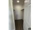 Walk-in closet featuring shelving for ample storage space and wood-look flooring at 7313 Shanna Cir, Indianapolis, IN 46236