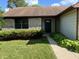 Home exterior with stone accents, green landscaping, and a covered front entryway at 7313 Shanna Cir, Indianapolis, IN 46236