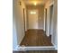 Inviting foyer with hardwood floors, a front door with decorative windows, and neutral paint at 7313 Shanna Cir, Indianapolis, IN 46236