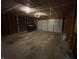 Unfinished garage offering ample space for parking and storage, with exposed framing at 7313 Shanna Cir, Indianapolis, IN 46236