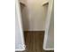 An open walk-in closet featuring wood vinyl plank flooring at 7313 Shanna Cir, Indianapolis, IN 46236