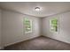 This bedroom features two windows with views of the outdoors at 7424 North Dr, Lawrence, IN 46226