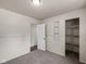 Bright bedroom with neutral decor, closet, and carpet at 7424 North Dr, Lawrence, IN 46226