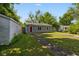View of home from backyard with shed at 7424 North Dr, Lawrence, IN 46226