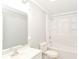 Bright bathroom with modern fixtures, a shower-tub combination, and neutral paint at 7643 S Delaware St, Indianapolis, IN 46227
