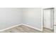 This bedroom features neutral paint, modern baseboards, and beautiful, light-colored wood flooring at 7643 S Delaware St, Indianapolis, IN 46227