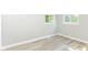 Cozy bedroom featuring fresh gray paint and modern vinyl plank flooring at 7643 S Delaware St, Indianapolis, IN 46227