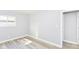 Cozy bedroom with gray walls and light-colored wood flooring, offering a neutral and inviting space at 7643 S Delaware St, Indianapolis, IN 46227