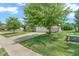 Charming home featuring a well-maintained lawn, a concrete driveway, and mature trees at 793 Penny Ln, Pittsboro, IN 46167