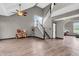 Spacious living room featuring modern flooring, a staircase, and high ceilings at 793 Penny Ln, Pittsboro, IN 46167