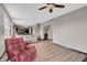 Open-concept living room features wood floors and flows into the kitchen for easy entertaining at 793 Penny Ln, Pittsboro, IN 46167
