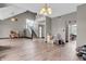 Bright open living room with wood floors and staircase, ready for new owners at 793 Penny Ln, Pittsboro, IN 46167