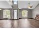 Bright living room with arched windows, high ceilings, and contemporary flooring at 793 Penny Ln, Pittsboro, IN 46167