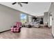 Comfortable living room featuring a large window, wood floors and neutral decor at 793 Penny Ln, Pittsboro, IN 46167
