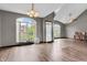 Bright living room with wood floors, large windows, and a vaulted ceiling at 793 Penny Ln, Pittsboro, IN 46167