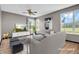 Bright living room with hardwood floors and a modern aesthetic through virtual staging at 793 Penny Ln, Pittsboro, IN 46167
