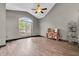 Inviting living room showcasing a large arched window, high ceilings, and modern flooring at 793 Penny Ln, Pittsboro, IN 46167