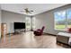 Large living room with hardwood floors, natural light and ample space to entertain at 793 Penny Ln, Pittsboro, IN 46167