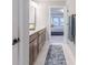 Modern bathroom vanity with dual sinks and access to a bedroom at 9124 Anthem Ave, Plainfield, IN 46168