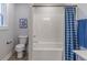 Clean, well-lit bathroom with a shower-tub combo and stylish curtain at 9124 Anthem Ave, Plainfield, IN 46168