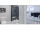 Contemporary bathroom featuring a tiled shower with glass door and adjacent walk-in closet at 9124 Anthem Ave, Plainfield, IN 46168