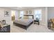 Comfortable bedroom featuring a modern bed, stylish decor, and bright natural light from the windows at 9124 Anthem Ave, Plainfield, IN 46168