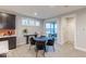 Cozy dining area near the kitchen with sliding glass doors and a modern table set at 9124 Anthem Ave, Plainfield, IN 46168