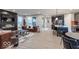 Open-concept living room features modern fireplace, large windows, and seamless flow to kitchen at 9124 Anthem Ave, Plainfield, IN 46168