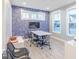 Bright office space with modern decor, large windows, and a stylish accent wall. Great for meetings at 9124 Anthem Ave, Plainfield, IN 46168