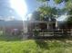 Backyard features a large wooden deck ideal for outdoor dining and relaxation with direct access to the house at 9783 Lee Ct, Columbus, IN 47203