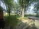 Overlooking well-maintained backyard with trampoline and shed at 9783 Lee Ct, Columbus, IN 47203