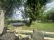 Well-maintained backyard featuring a trampoline, and sprawling green lawn at 9783 Lee Ct, Columbus, IN 47203