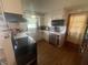 Functional kitchen featuring stainless steel appliances, ample counter space, and wood cabinets at 9783 Lee Ct, Columbus, IN 47203