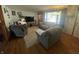 Inviting living room with wood floors, comfortable seating, and a view of the front yard at 9783 Lee Ct, Columbus, IN 47203