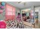 Playful bedroom with patterned bedspread, walk-in closet, and natural light at 3331 Loral Dr, Anderson, IN 46013