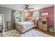 Cozy bedroom with a large ceiling fan, comfy bed, and natural light at 3331 Loral Dr, Anderson, IN 46013